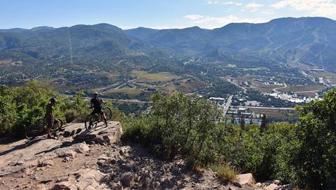 A bike rider overlooking the Yampa Valley from Emerald Mountain.