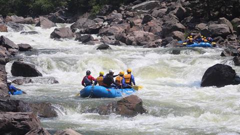 A group of people rafting on the Gore River.