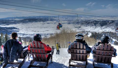 four people overlooking the Yampa Valley enjoying apre ski.