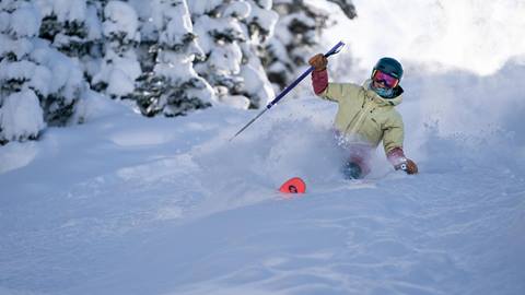 Female Skier in Deep Powder